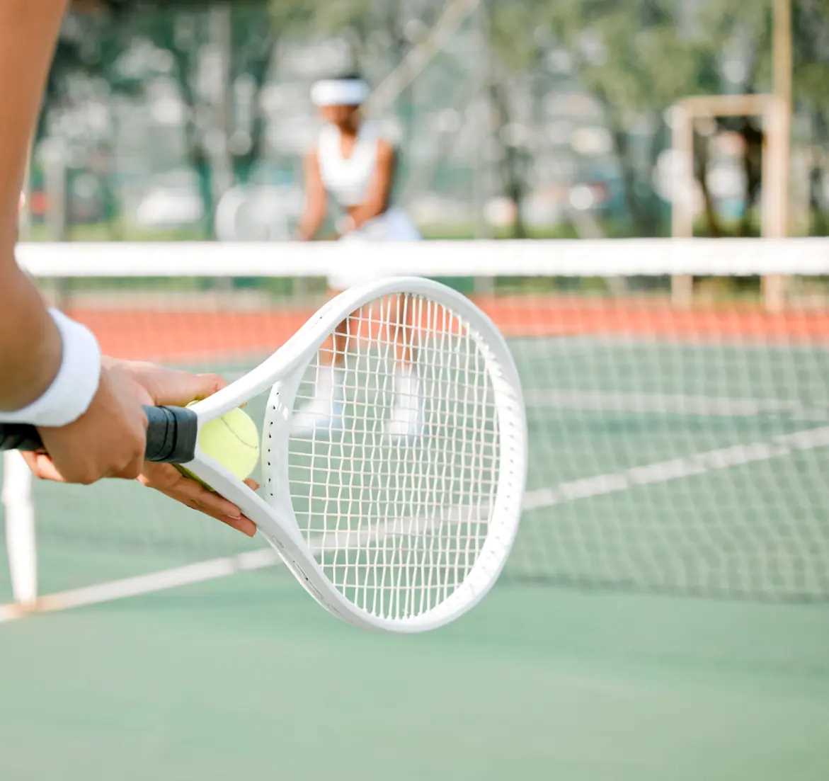 Women playing tennis together