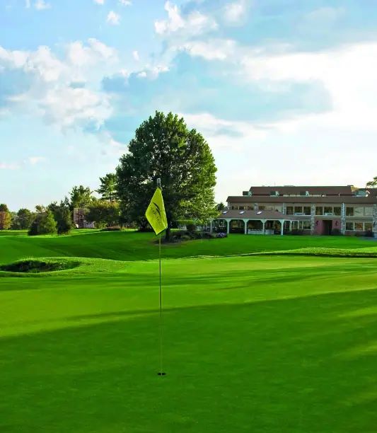 Golf Course With Clubhouse in the Background